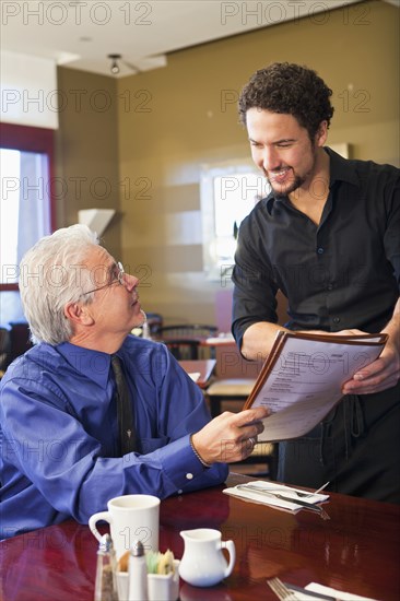 Businessman ordering food in cafe