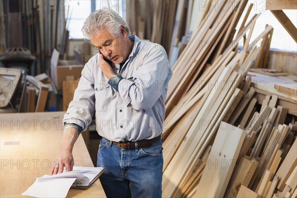 Hispanic craftsman working in studio