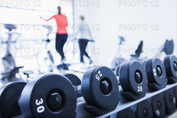 Close up of dumbbells on rack in gym