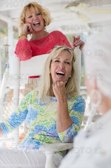 Caucasian women laughing together