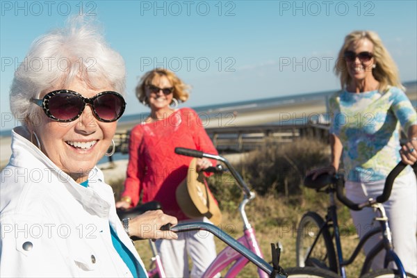 Caucasian women riding bicycles together