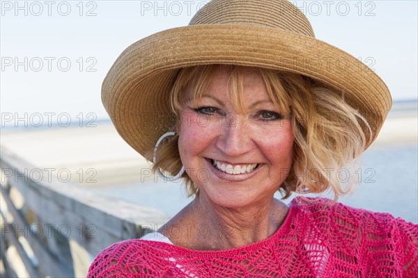 Caucasian woman smiling on beach