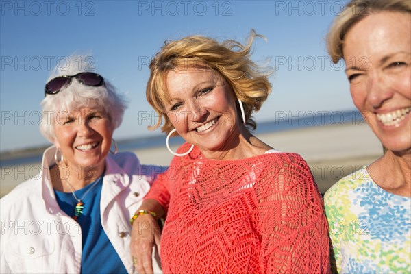 Caucasian women smiling on beach