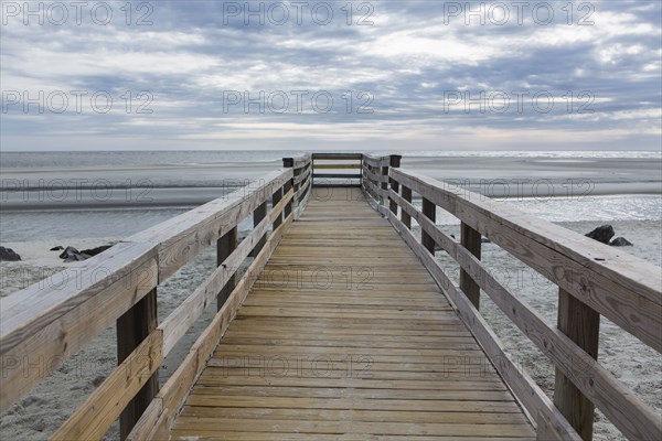 Wooden pier over beach