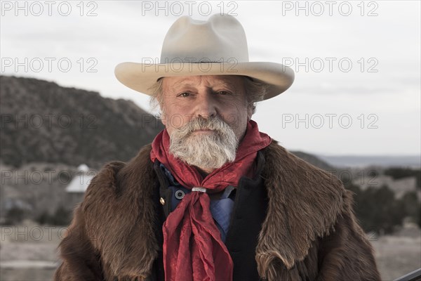 Caucasian man standing in dusty landscape