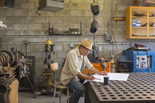 Middle Eastern man working in workshop