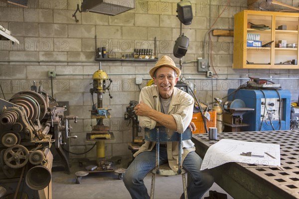 Middle Eastern man working in workshop