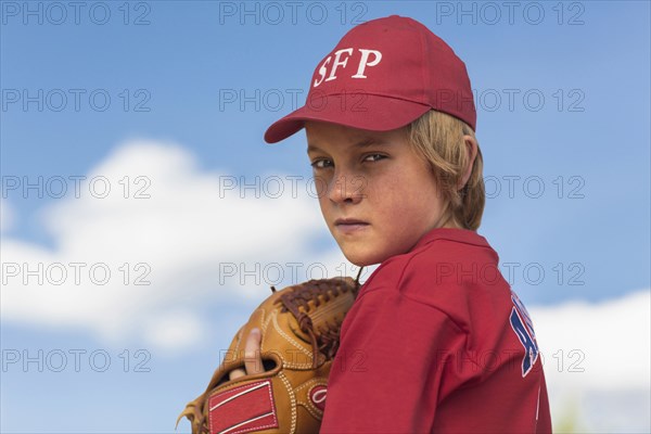 Caucasian boy playing baseball outdoors