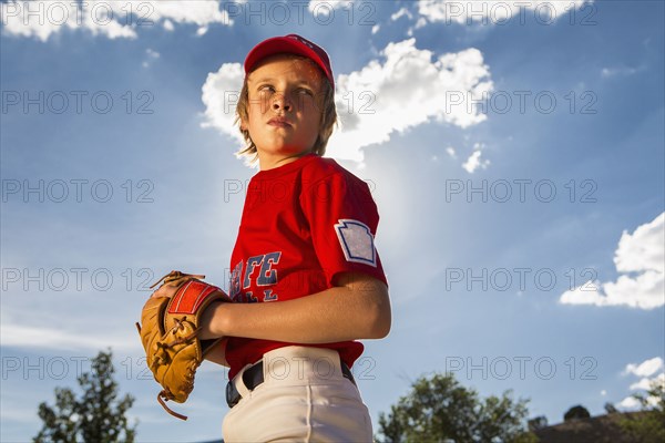 Caucasian boy playing baseball outdoors