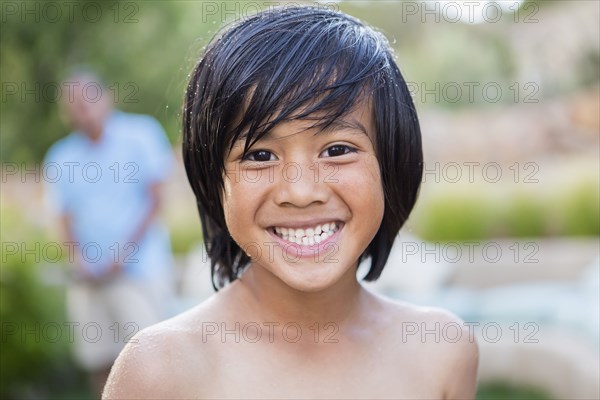 Boy smiling outdoors