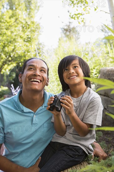 Father and son smiling outdoors