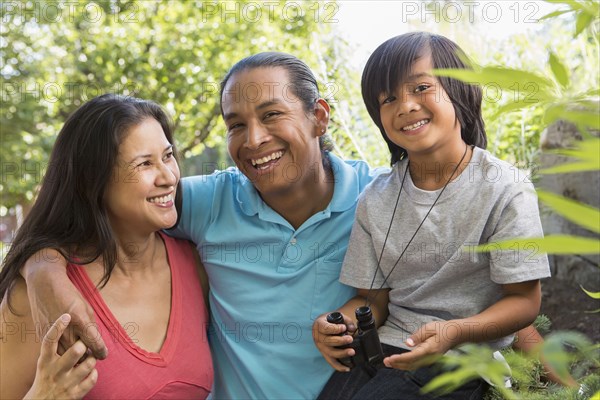 Family smiling outdoors