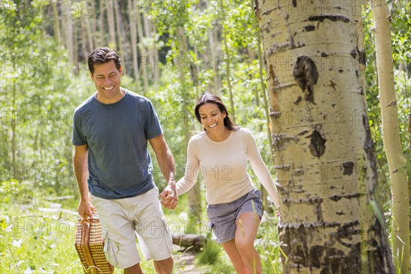 Couple walking together in forest