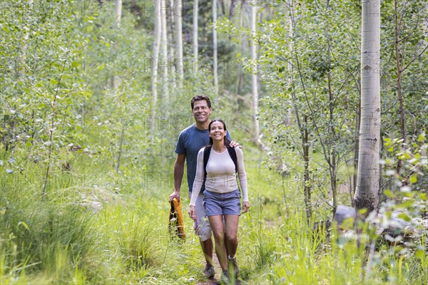 Couple walking together in forest