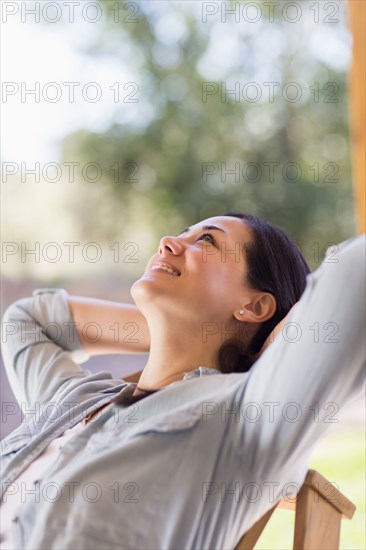 Mixed race woman relaxing indoors