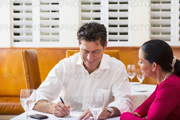 Business people talking at restaurant