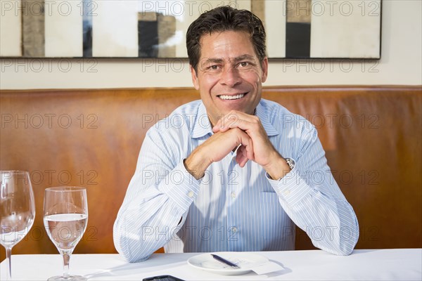 Caucasian businessman working at restaurant