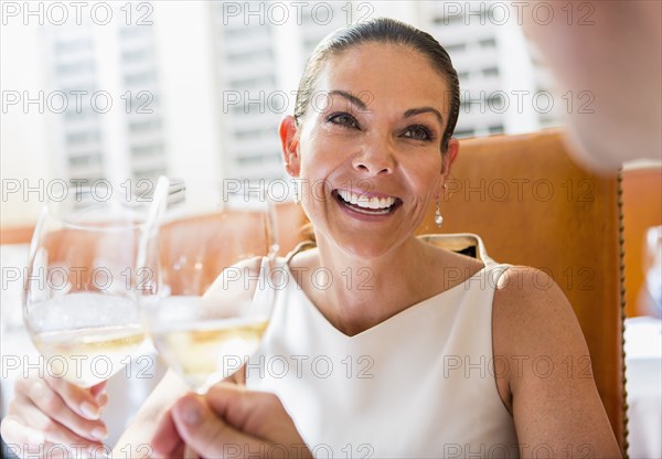 Couple toasting each other at restaurant