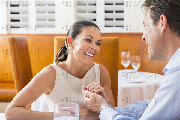 Couple sitting together in restaurant