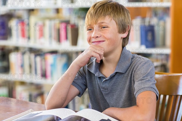 Student smiling in library