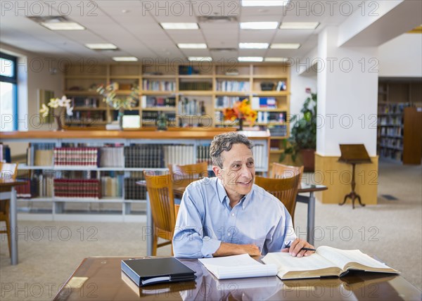Man reading in library