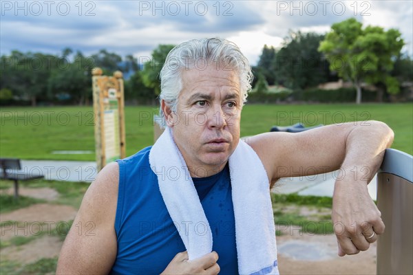 Hispanic man resting in park