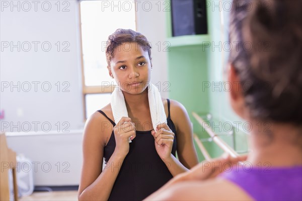 Ballerina talking with teacher in studio