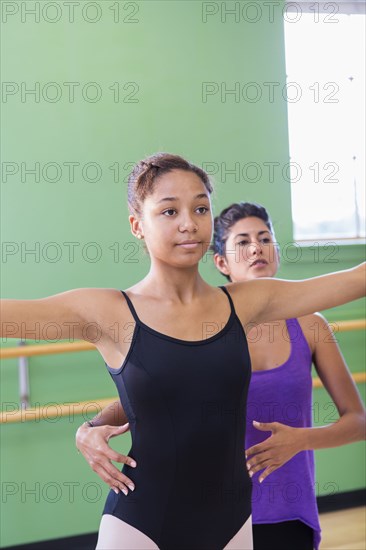 Ballet dancer practicing with teacher