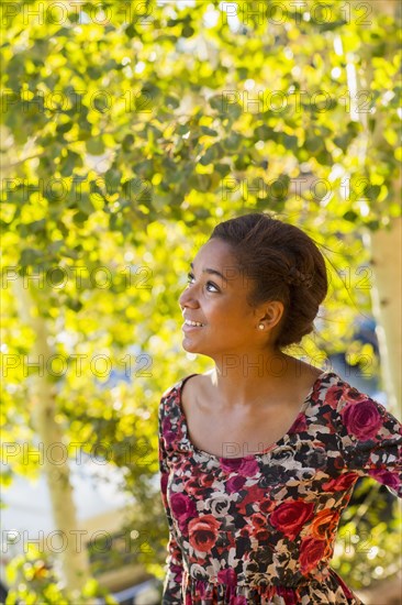 Mixed race teenage girl smiling outdoors