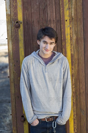 Mixed race teenage boy smiling