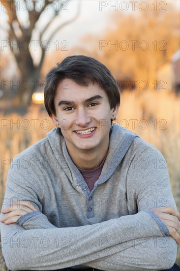 Mixed race teenage boy smiling