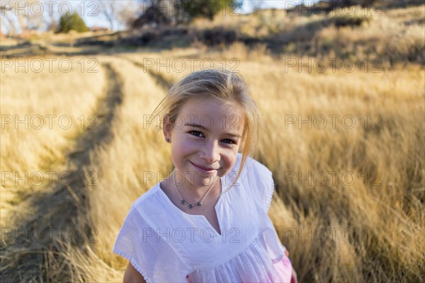 Caucasian girl smiling outdoors