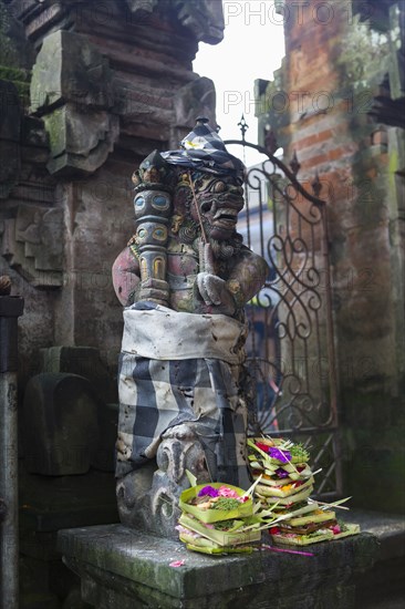 Offerings at base of Hindu statue