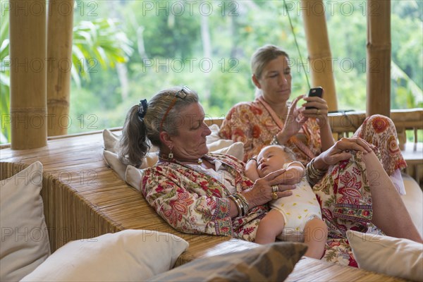 Caucasian family relaxing on outdoor patio