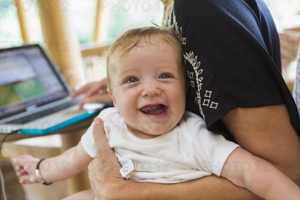 Caucasian mother holding baby boy