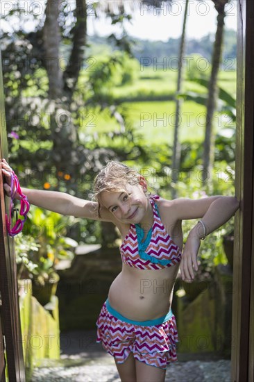 Caucasian girl smiling in tropical rainforest