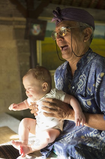 Hotel concierge holding baby