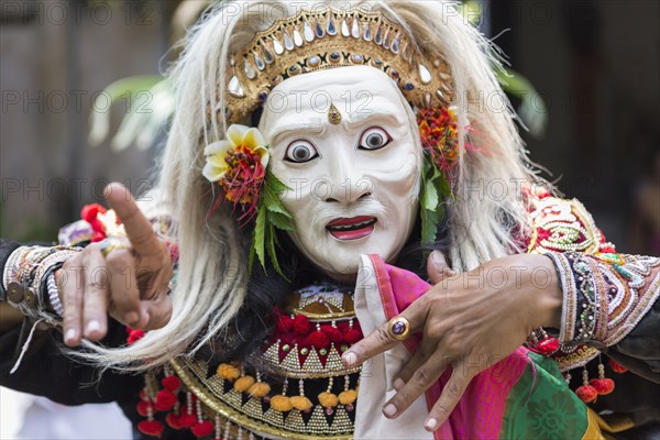 Balinese performer wearing mask and costume