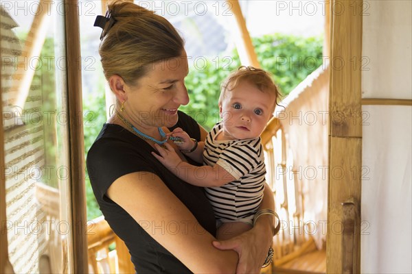 Caucasian mother holding baby