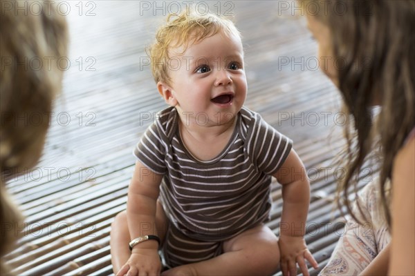 Caucasian children sitting on floor