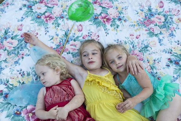 Girls laying on blanket together