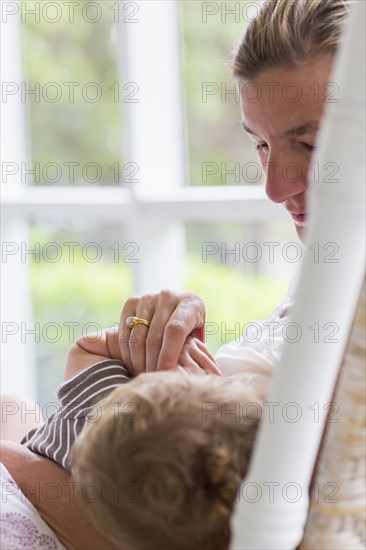 Caucasian mother nursing baby