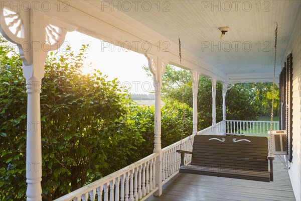 Swing on porch of traditional house