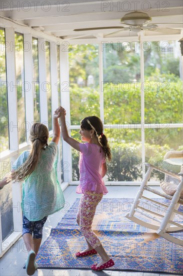 Girls playing together on porch