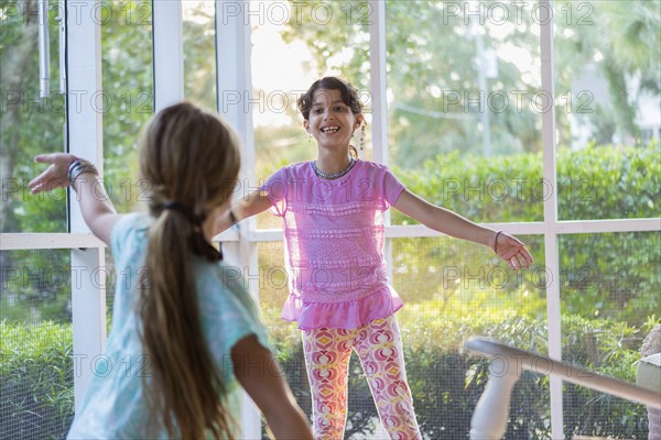 Girls playing together on porch