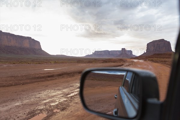 Rock formations and desert landscape viewed from car