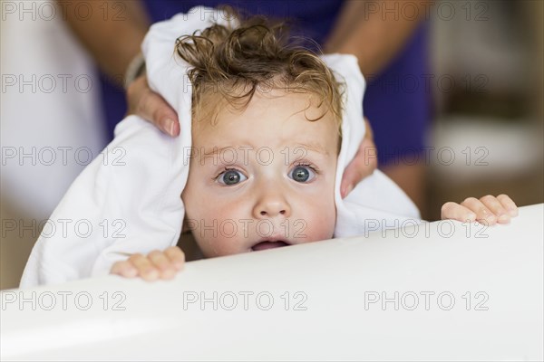 Mother drying hair  of baby son