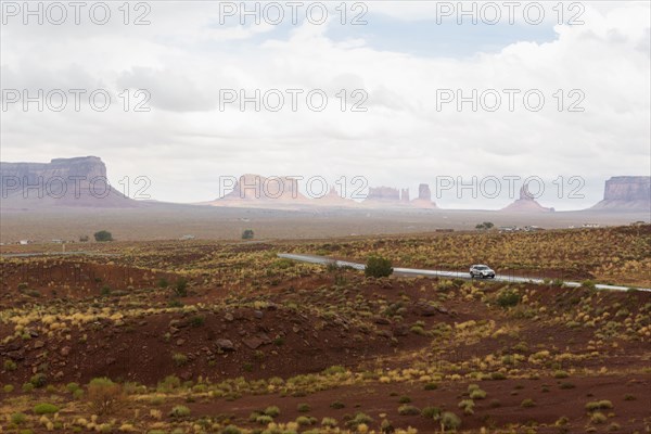 Rock formations and remote road in desert landscape