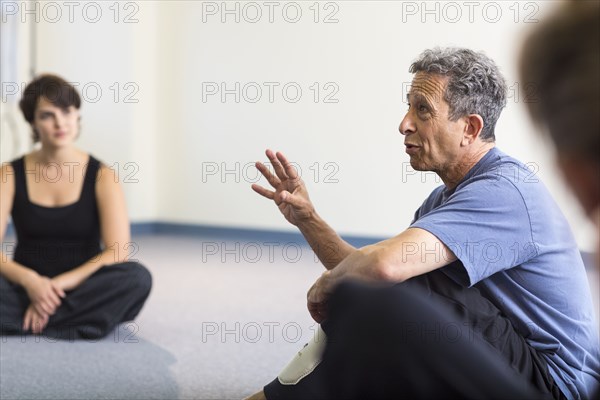 Teacher speaking to students in acting class