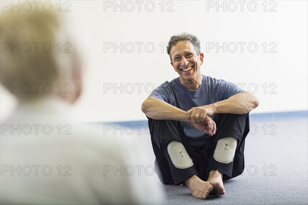 Teacher smiling at student in acting class